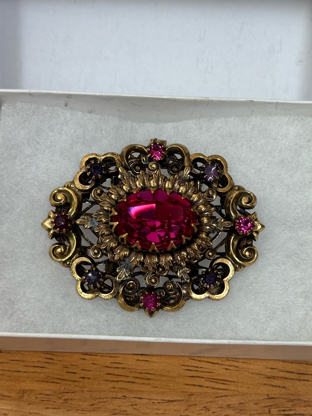Hobé signed 1950s Victorian-style brass filigree oval faceted pink stone brooch